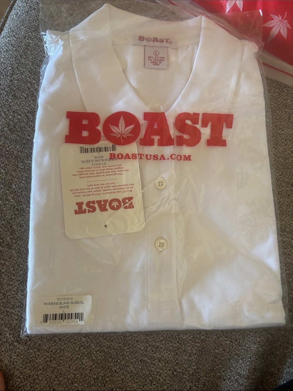 BOAST women’s  White Polo Shirt with Red Logo